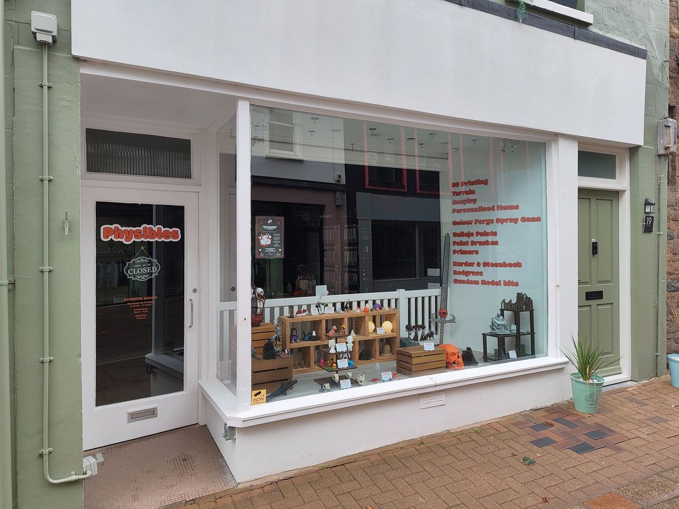 The Physibles shopfront on Bath Street, with orange lettering on the window